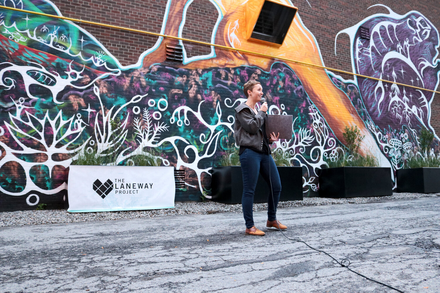 Late Michelle Senayah, Founder and ED of The Laneway Project unveiling the Nicholson Lane project in the St. Lawrence neighborhood delivering their revitalization masterplan in 2021.